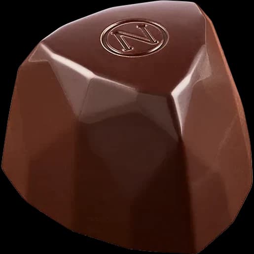 Bonbon de chocolat noir aux facettes géométriques